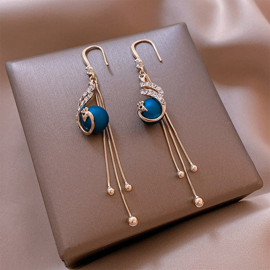 Léonie | Boucles d'oreilles en perles bleues inspirées du paon